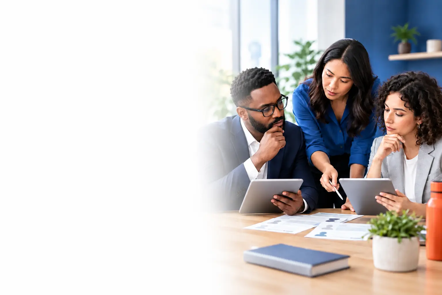 Diverse colleagues collaborating around a table in a modern office